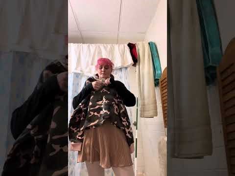 Grwm we’re styling a V-neck army sweater with a mini skirt and pantyhose