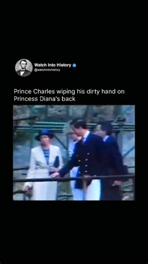 Watch Into History on Instagram: "The incident took place during a royal visit in the early 1980s, when Prince Charles and Princess Diana were attending an outdoor public engagement. As they stood together near a railing, Charles had briefly touched a surface and appeared to have dirt or residue on his hand. Moments later, he casually wiped his hand on the back of Diana’s clothing, likely without thinking and without realizing cameras were focused on them. Diana did not visibly react at the time