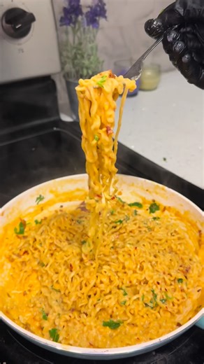 Drishti Khan on Instagram: "Viral cheesy Maggie noodles 🍝 Ingredients: * 2 packets Maggi noodles * 2 Maggi masala packets * 2–4 cheese slices * 1 tsp Schezwan chutney/ketchup * 1 tsp mayonnaise/ chick fil a sauce * 1 cup milk (adjust as needed) * Salt to taste * ½ tsp chilli flakes * ½ tsp oregano * Fresh coriander, chopped * Water (as required) . . 👉 Follow for more cooking chaos 🍳😂 #explore #reelsvideo #food #viral #maggie trending cheesaggie easy recipe night cravings"