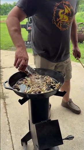 Nothing beats a cast iron skillet, pork chops, and homemade mushroom gravy cooked outside.