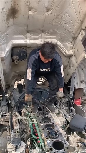 Removing a Diesel Engine Piston.