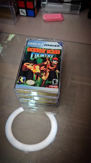 Relive the jungle legend! The Donkey Kong Country trilogy on GBA brings all three SNES classics to handheld form—bananas, barrels, Kremlings, pirates, and K. Rool across epic adventures. A must‑have for retro fans and collectors! #donkeykongcountry #snes #gameboyadvance #retrogaming #throwback | Palmetto Jo's Game Cases