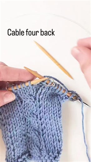 A cable four back (C4B) just means slip two stitches to the cable needle and hold them to the back of your work, knit two stitches, and then knit the two stitches from the cable needle. This creates a four stitch cable. Save this reel if you've never knit a cable before! | Twice Sheared Sheep