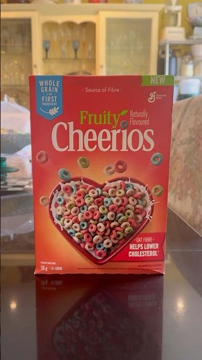 Munching Fruity Cheerios breakfast cereal