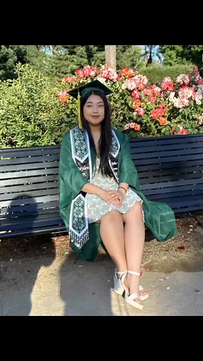 Taking pictures of my niece with her graduation clothes. Congratulations. | Nkaujnag Vang Thor