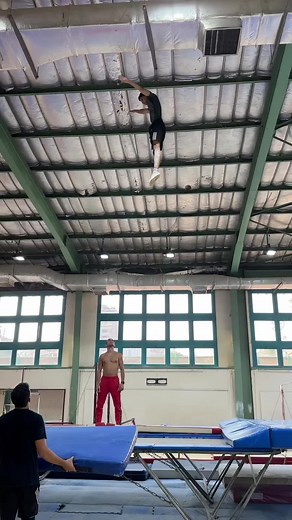 Acrobatic Flip Performance in Indoor Gym