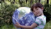 Boy with inflatable Earth ball.