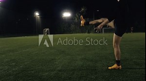 Full length of rugby player placing ball shot by leg, football sport arena, close up slow motion kick the ball