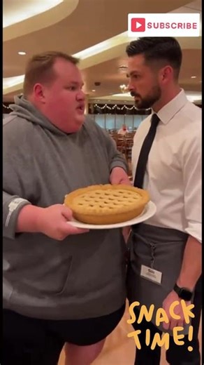 Man takes the whole pie off the buffet!