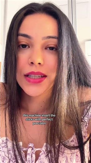 Machine inserting sticks into candy pieces #manufacturing