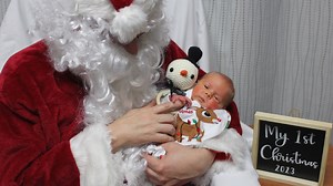 'NICU cuddler' dressed as Santa visits hospitalized babies in Grand Rapids