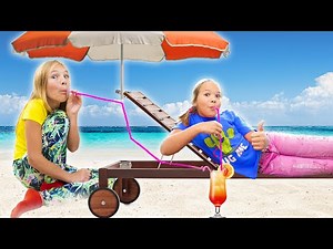 Amelia and Avelina beach holiday fun, Akim plays with toys