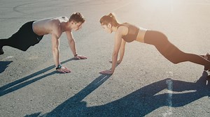 Trainer motivates man during outdoor workout - Free Stock Video