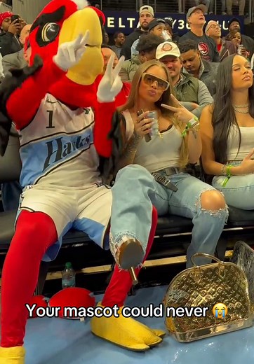 Latto Joins Harry the Hawk at NBA Game