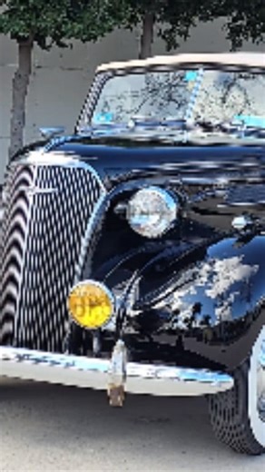 1937 Chevrolet convertible at the Granddaddy Drive In car show during the Grand National Roadster show, Pomona California | Samspace81