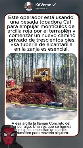 Una topadora Cat empuja toneladas de arcilla roja para construir un camino privado