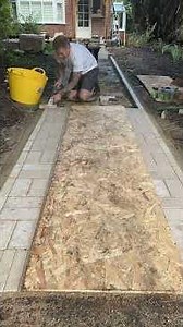 Setting in the limestone edging for garden footpath project