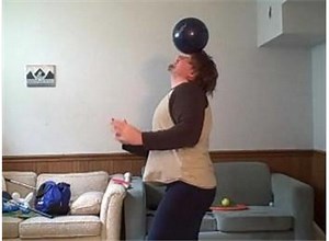 Most Times Throwing A Bowling Ball Onto Forehead, Balancing It, Rolling It To Neck, And Bouncing It Back To Front Of Body In One Minute