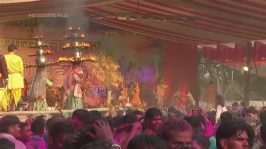 Spring in India: Colourful powder fills the air as an early Holi festival begins