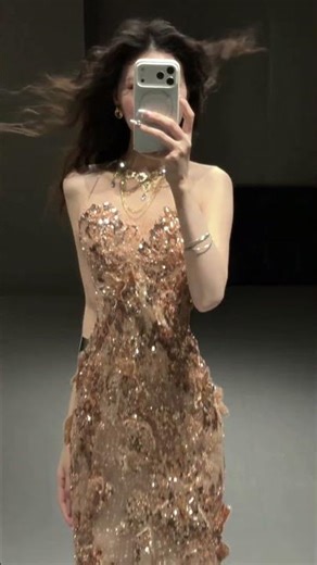 As champagne gold and rhinestones flow across the skin, every inch of the fabric speaks of luxury.