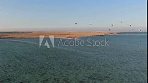 Lots of kites in the sky above the sea, cruise ships on the background, 4k