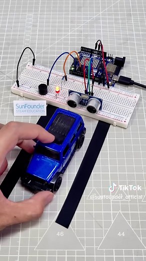 Arduino parking sensor that beeps faster as you get closer