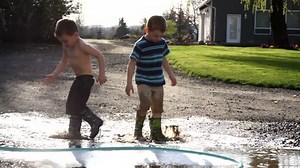 Two Young Boys Playing Mud Puddle Stock Footage Video (100% Royalty-free) 4553954 | Shutterstock