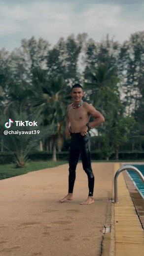 Poolside Preparation: Male Swimmer Getting Ready to Dive