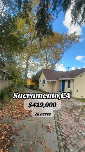 Privacy & full of warmth, character, and potential, this 1925 cottage - likely one of the original homes in the neighborhood - rests on a tree-studded 0.28-acre lot near American River College. Take a look inside to a spacious living room with a cast-iron fireplace, built-in bookshelves, vintage wallpaper, and skylights that fill the space with light and charm. The hall bath features a classic clawfoot tub and a small standing shower that’s ready for a refresh. The light-filled kitchen and dinin