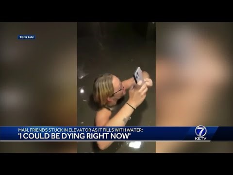 Man, friends stuck in elevator as it fills with water