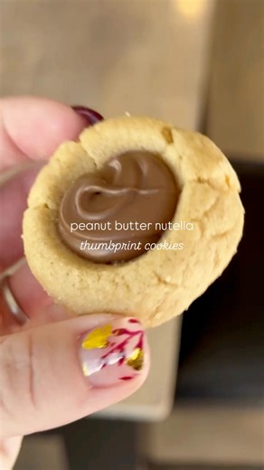 PB Nutella… the Christmas duo you didn’t know you needed. 🎄✨ These soft, melt-in-your-mouth peanut butter thumbprints filled with warm, gooey Nutella are guaranteed to disappear off your holiday cookie tray. Recipe link in comments! Cooking with Karli baking | baker | bakery | food blog | food blog feed | baking at home | pb | peanut butter | cookies | baking fun | thumbprint | nutella | nutella lover | Cooking with Karli