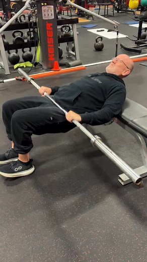 I am not a Hip Thrust fan. I don’t even like the name. Thrust to me indicates a lack of control. The loads are heavy and the exercise is uncomfortable. If done poorly there is lots of lumbar extension substituted for hip extension. We use the term Hip Lift as I think it indicates more control and, we use the unilateral version ( shown second). Dare I say “more functional”? 😉 We do not use the Olympic bar for space reasons but, I did for this video. | Michael Boyle's StrengthCoach.com