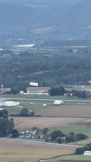 Dropping the advertisement flag at the Bellefonte airport. | RK Chase Your Dreams Pet Retreat