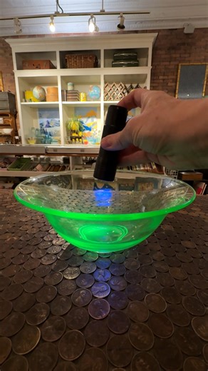 Have you ever seen a glass piece that glows under blue light? It’s called Uranium glass, and it seems truly magical! This special glass, also known as Vaseline glass, has tiny bits of uranium inside that make it glow bright green when you shine a blue light on it. It first started being made in the early 1800s, when glassmakers in Europe began experimenting with uranium to create beautiful colors. Over time, it became popular in the United States, and people loved using it for vases, bowls, and 