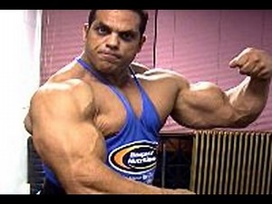 Bodybuilder David Hughes trains, poses