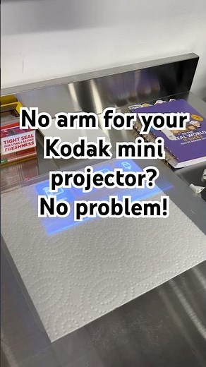 A no-arm, overhead projection hack for the Kodak 150 mini projector.