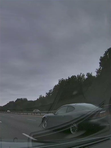 Aston Martin DB7 passes on the right