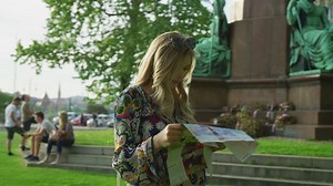 Young woman with a map, in Budapest.