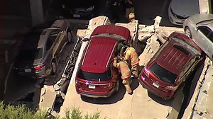 Firefighters are searching through the rubble for victims after a parking garage partially collapsed in Irving. Watch live: on.nbcdfw.com/Z32MDKc | NBC DFW