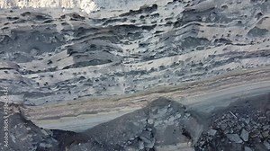 looking down on Cliff full of nests of the burrowing parakeet on the coastline of Argentina