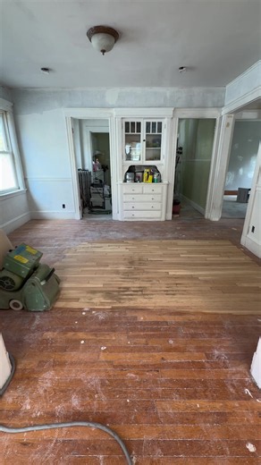 This home in Arlington, Massachusetts, got a beautiful hardwood floor improvement. The original hardwood floors had years of wear, scratches, and an outdated finish. Instead of replacing them, we restored the existing wood through a complete sanding, staining, and refinishing process. Our team started by sanding away the old finish to expose the bare wood, followed by buffing and surface preparation to ensure an even stain application. We then applied Bona Medium Brown stain to create a rich, wa