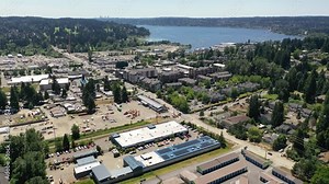 Cinematic 4K aerial drone footage of downtown, commercial area and the waterfront of Kenmore, an upscale, affluent neighborhood by Lake Washington and Bothell, near Seattle