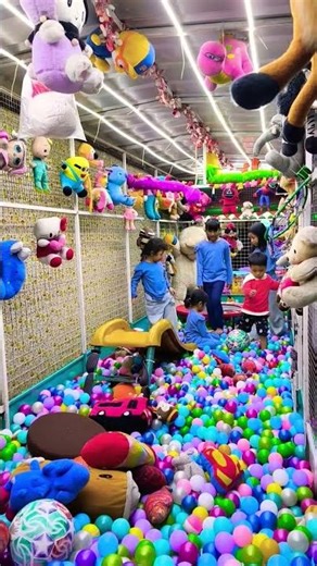 lots of cute dolls in the ball pool