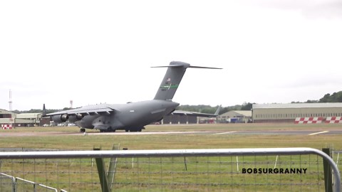 Watch a massive military jet power through rain at takeoff
