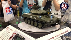 Check out the crazy great driving (as well as aiming, firing, turret steering and all around sound) of this built up and ready Tamiya 1/16 M551 Sheridan RC Tank at last year's Shizuoka Hobby Show. The guy driving is a distinguished Japanese gentleman in a suit, yet he's smiling as he's trying to aim the turret at our camera and firing that virtual howitzer! We're usually in Shizuoka Japan this time of the year giving you a report of what's new and coming, but hey, we're still doing that from the