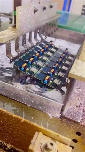 Soldering PCB by dipping assembled PCB in to melted tin. #machine #factory #cnc