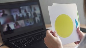 An elementary school teacher conducts an online lesson for children. Distance lesson, learning at home, technologies for a schoolchild, business conference. Children do their homework at home.