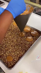 Homemade caramel being poured for our signature Bear Claws 🤤 Hope ya’ll have had a relaxing Sunday! - #caramel #candymaking #bearclaws #riverstreetsweets #pour #sundayfunday | River Street Sweets