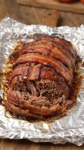 ✨ Bacon-Wrapped Smoked Meatloaf ✨ Fall-apart tender smoked meatloaf wrapped in crispy, golden bacon for an incredible, savory dinner. 🍴 Ingredients: - 3 lbs ground beef - 12-15 bacon slices - 1 onion, finely diced - 3 cloves garlic, minced - 1/2 cup breadcrumbs - 1 egg - 2 tbsp BBQ sauce - 1 tsp garlic powder - 1 tsp onion powder - 1 tsp smoked paprika - Salt and black pepper to taste 👩🏽‍🍳 Instructions: 1. In a large bowl, combine ground beef, diced onion, minced garlic, breadcrumbs, egg, BB