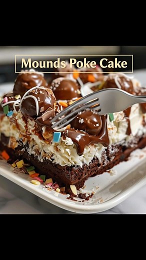 This Mounds Poke Cake is a chocolate and coconut lover’s dream come true. Moist chocolate cake is filled with creamy coconut mixture, then topped with whipped topping and a drizzle of rich chocolate. Every bite tastes just like the classic candy bar, but even more indulgent. | Recipe Stories